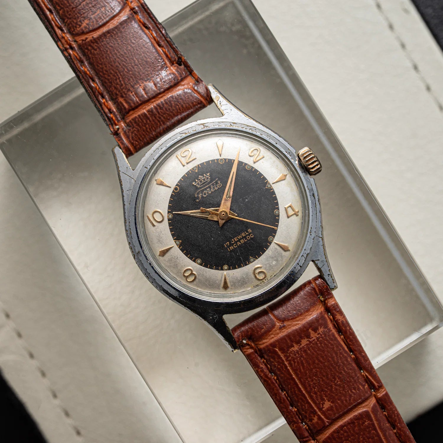 Vintage watch Fortis, Ref. 2127, Cal. ETA 1080, Men’s Manual Wind, 1958 with brown leather strap on a white background