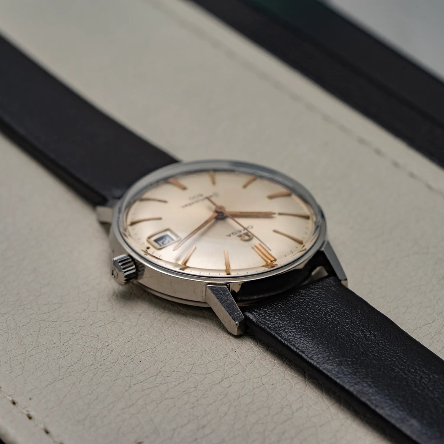 Vintage-style watch Omega Seamaster 600, Ref. 136.011, Cal. 611, 1966 with black strap on a textured surface