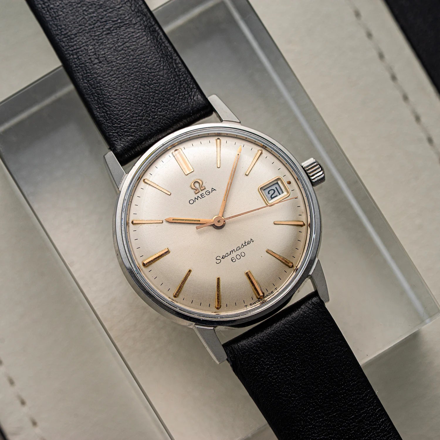 Vintage Omega Seamaster 600, Ref. 136.011, Cal. 611, 1966 watch with black leather strap on a metallic surface