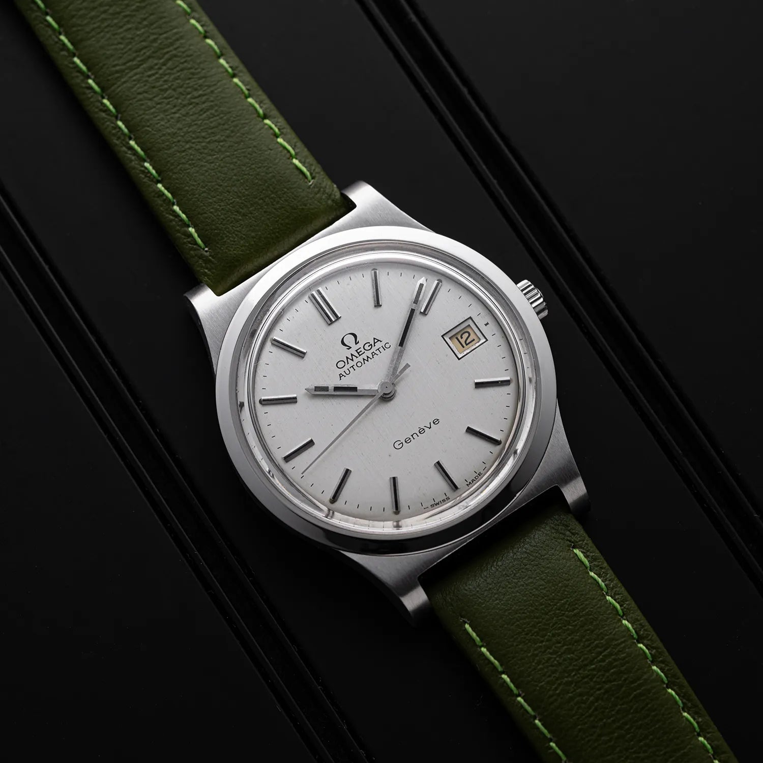 Omega Genève, Ref. 166.0168, Cal. 1012 top view on a dark background