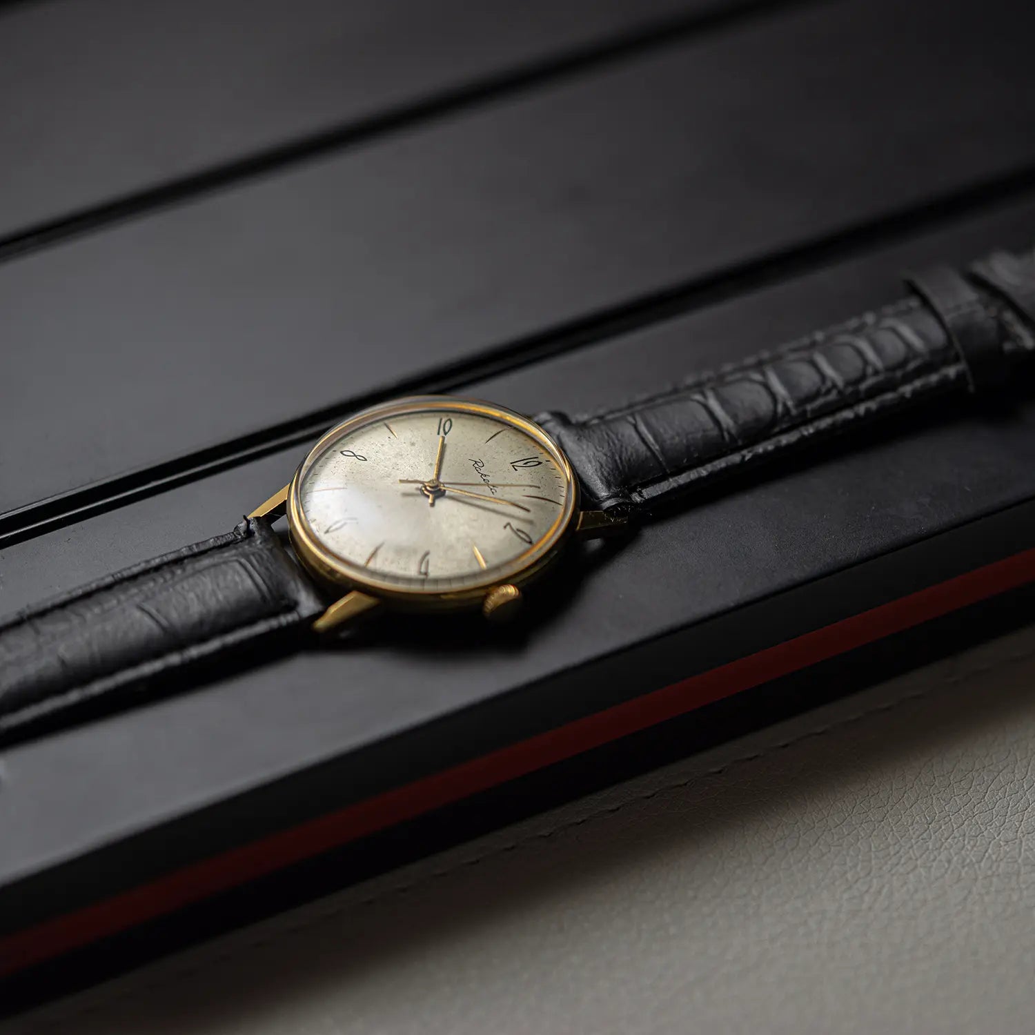 Raketa Gold Plated 2609.1 side view on black background