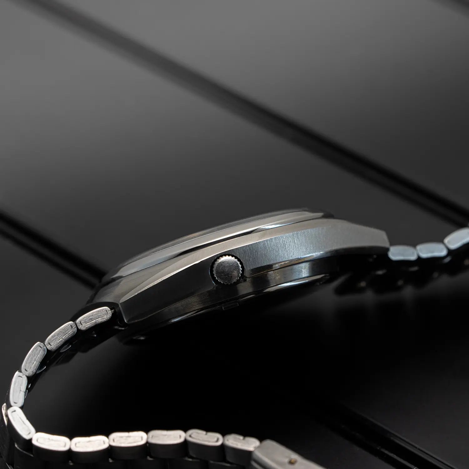 Close-up of a Seiko 5 7009 8431 case with a black background