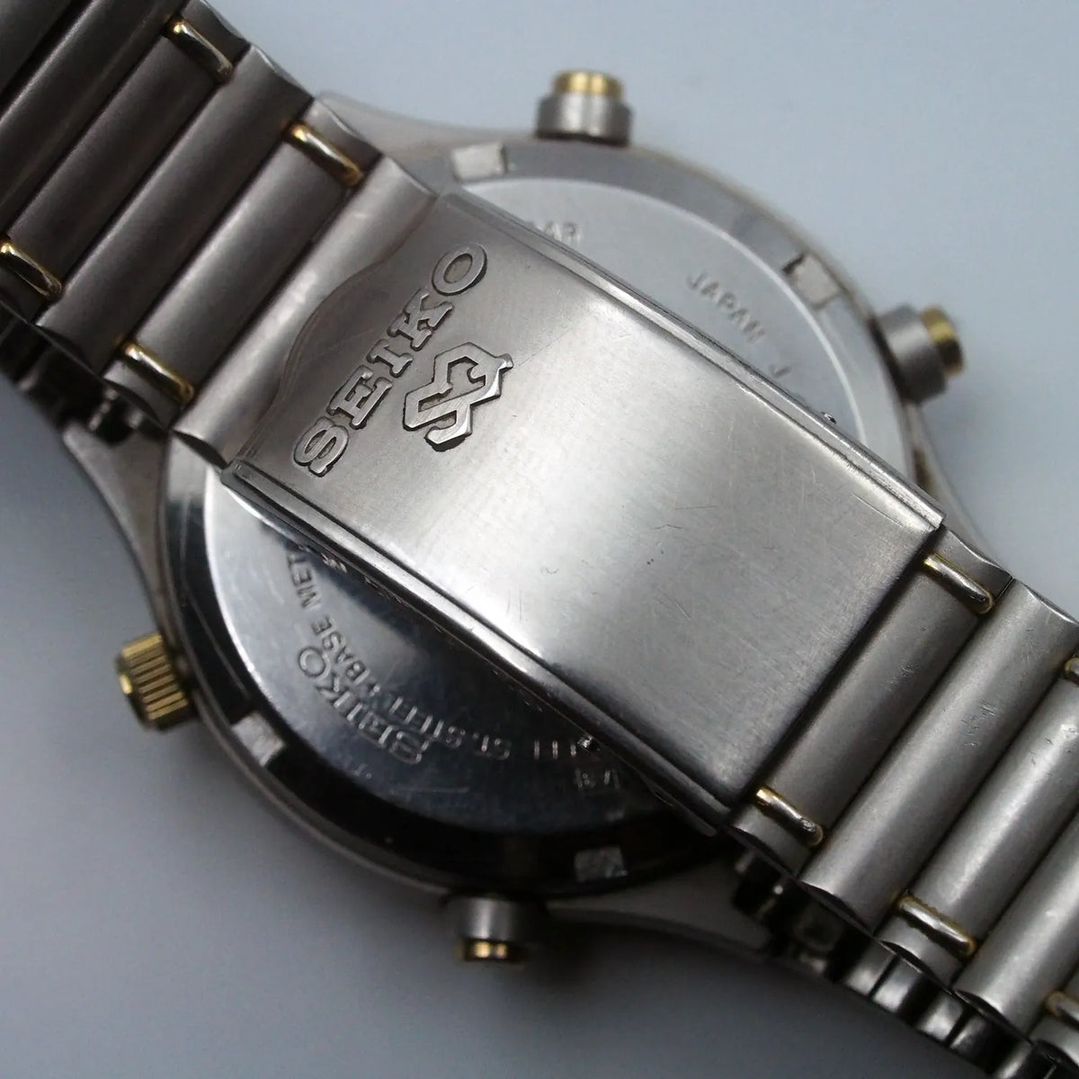 Close view of the silver dial on a 1985 Seiko Sports 150 7A38-7130 quartz chronograph