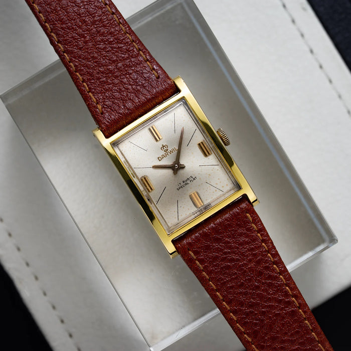 Darwil Special Flat vintage men’s watch from 1965 with rectangular gold plated case, silver dial, and brown leather strap, top view