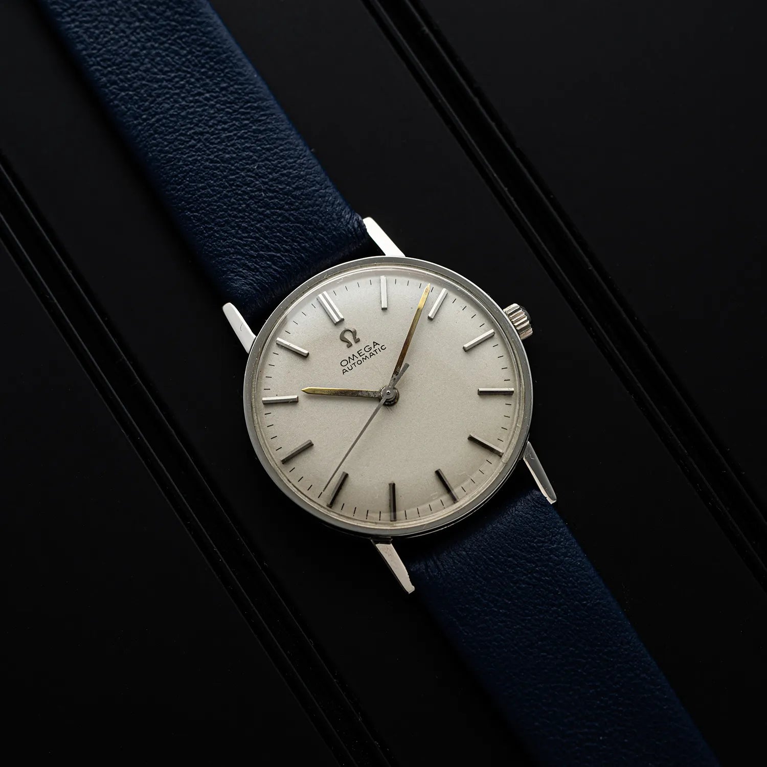 Omega, Ref. 14786SC, Cal. 552 with a blue strap on a black background