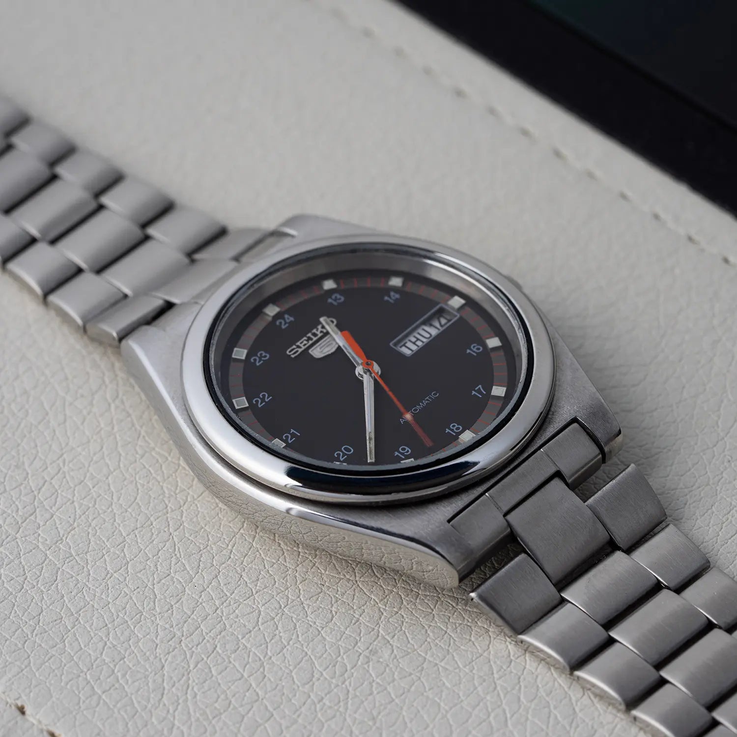 Seiko 5 6309 8980 Case on a light gray surface