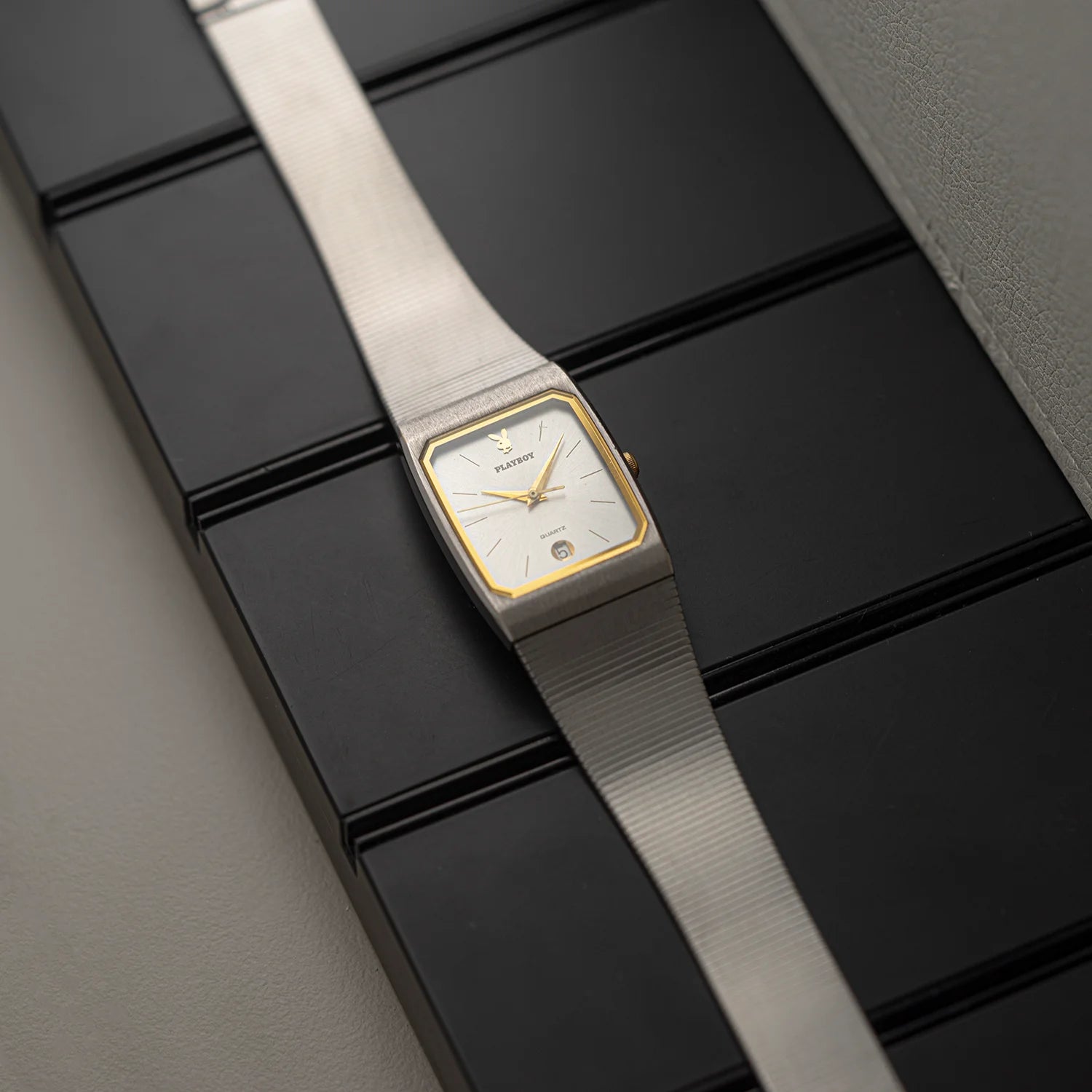 Side view of Seiko Playboy vintage quartz watch with slim tapered case and integrated metal bracelet